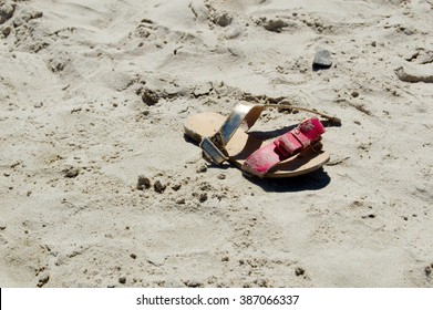 Little girl's lost shoe on a beach at Strand - Powered by Shutterstock
