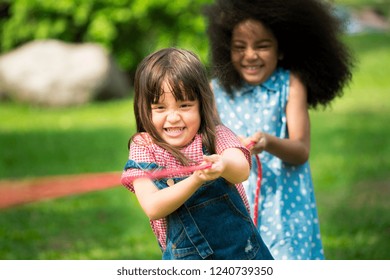 Little Girls Play Fun Game At Summer Camp. Children Camp Game Recreation And Summer Fun Activity.