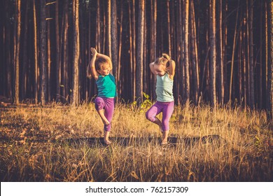 Little girls practicing yoga - Powered by Shutterstock