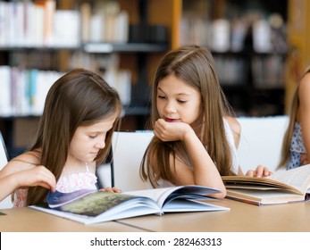 Little Girls Reading Books Library Stock Photo 324007094 | Shutterstock