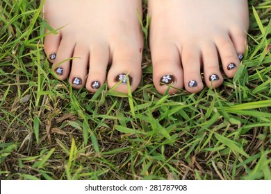 Little Girl's Toes With Naive Handmade Floral Nail Art Pedicure