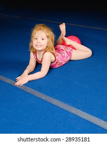 A Little Gymnast On Tumbling Mat