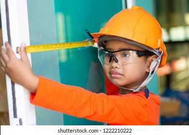little handyman boy asian  