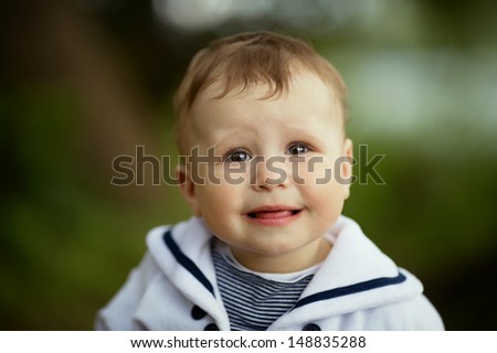 Similar – Image, Stock Photo Little cute boy looking at camera and sticking out his tongue