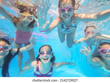 Little Happy  Kids Swimming  In Pool  Underwater.