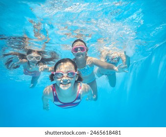 little happy  kids swimming  in pool  underwater. - Powered by Shutterstock