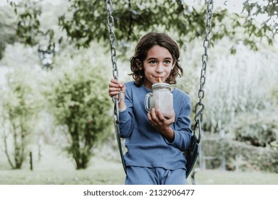 Little Hispanic Boy Drinking Chocolate Milk Shake In Mexico Latin America