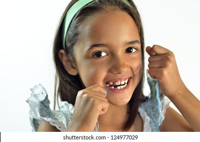 Little Hispanic Girl Flossing