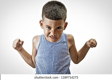 Little Hispanic Kid In A Challenge Posture Isolated On White.