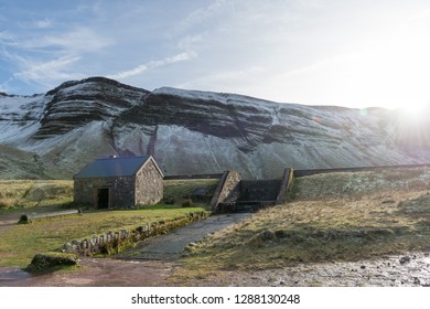 Little House Near Mountains With Snow (brecon Beacons National Park, Top Of Llyn Y Fan Fach)