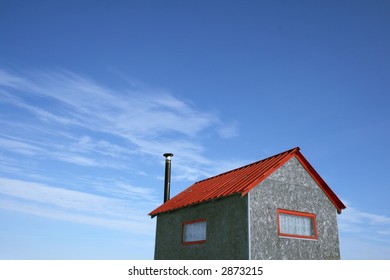 Little House With Red Roof And Chimney And Spacious Blue Sky (ice Fishing Hut).