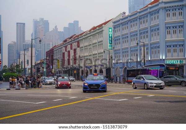 Little India\
Street / Singapore 09 13 2019\
Singapore streets Bus Cars Traffic\
Signals Little India China\
Town