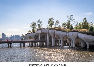Little Island on the Hudson River, a new manmade park of undulating hills built entirely on concrete piers.