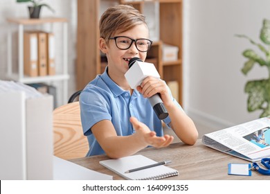 Little Journalist With Microphone Having An Interview In Office