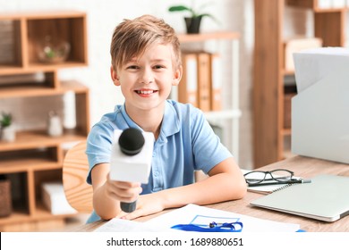 Little Journalist With Microphone Having An Interview In Office