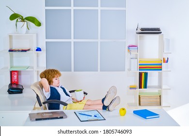 Little Kid Boy Businessman Wearing In Formalwear Reading Document And Standing In Office. Businessman Child In Office Relaxing In Chair. Kids Boss