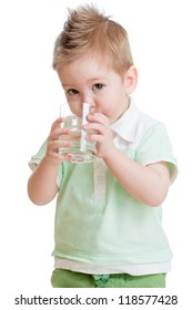 Little Kid Or Child Drinking Water From Glass Isolated On White. It Is A Boy. Studio Shot.