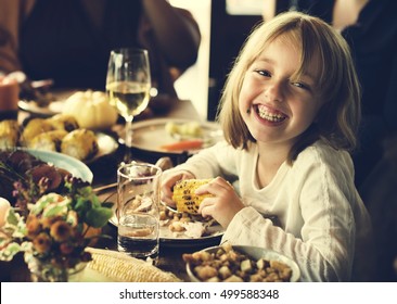 Little Kid Children Eating Corn Thanksgiving Celebration Concept