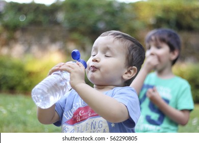 Little Kid Drinking Water