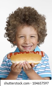 Little Kid Eating Hot Dog,Kid Holding Hot Dog.