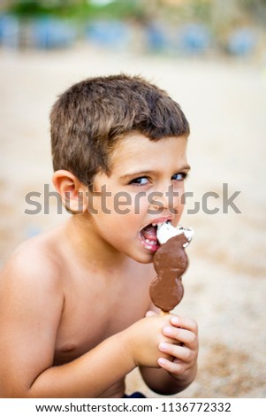 Image, Stock Photo Lovely boy eating an ice cream on the beach