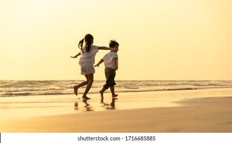 Little kid enjoying on beach. A happy family in asia Traveling, resting after the virus crisis, living life with family - Powered by Shutterstock