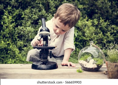 Little Kid Experimenting Science Microscope