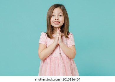 Little Kid Girl 5-6 Years Old Wears Pink Dress Have Fun Begging Parrents About New Toy Isolated On Pastel Blue Color Background Child Studio Portrait. Mother's Day Love Family People Lifestyle Concept