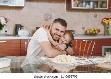 Little Kid Girl Help Man To Cook Lazy Dumplings Hugging In Light Kitchen At Table. Happy Family Dad, Child Daughter Cooking Food In Weekend Morning At Home. Father's Day Holiday. Parenthood Childhood