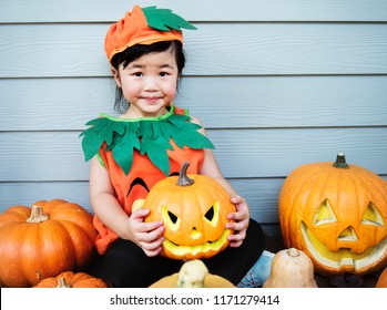 Little Kid With Halloween Pumpkin