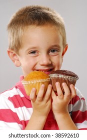 Little Kid Holding Two Cakes,kid Eating Snack Cakes.