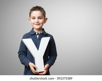 Little Kid Holding The Y Letter