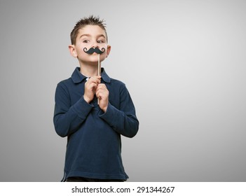 Little Kid Joking With A Moustache