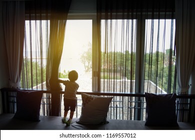 Little Kid Open Black Curtain (mosquito Net Fabric) To See Outside The Window With Sun Light .