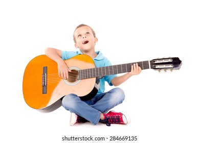 Little Kid Playing Guitar Isolated In White