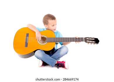 Little Kid Playing Guitar Isolated In White