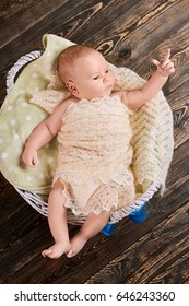 Little Kid Pointing Finger. Child In Basket, Top View. Baby Sign Language.