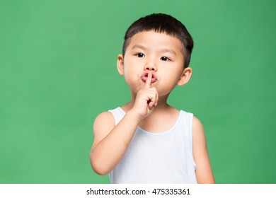 Little Kid Putting A Finger On His Lips