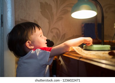 Little Kid Turning Off The Light