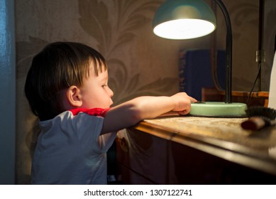 Little Kid Turning Off The Light