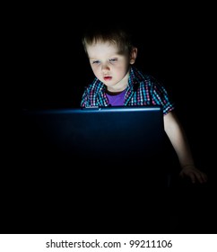 Little Kid Using Laptop By Night