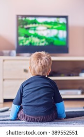 Little Kid Watching TV In The Living Room