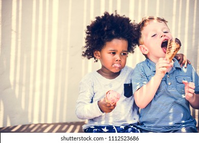 Little Kids Eating Yummy Ice Cream