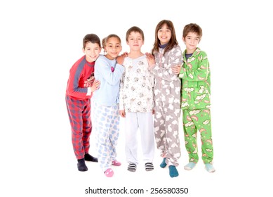 little kids on their pajamas in bed isolated in white