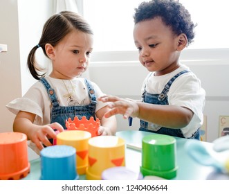 Little kids playing toys at learning center