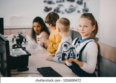 Little Kids With Robots At Stem Educaion Class