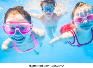 little kids swimming  in pool