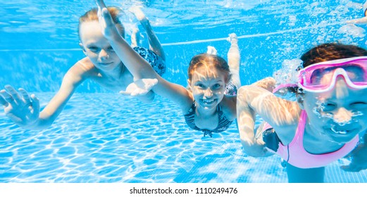 Little Kids Swimming  In Pool  Underwater.