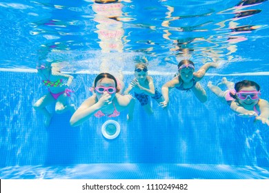 Little Kids Swimming  In Pool  Underwater.