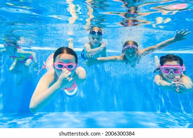 Little Kids Swimming  In Pool  Underwater.